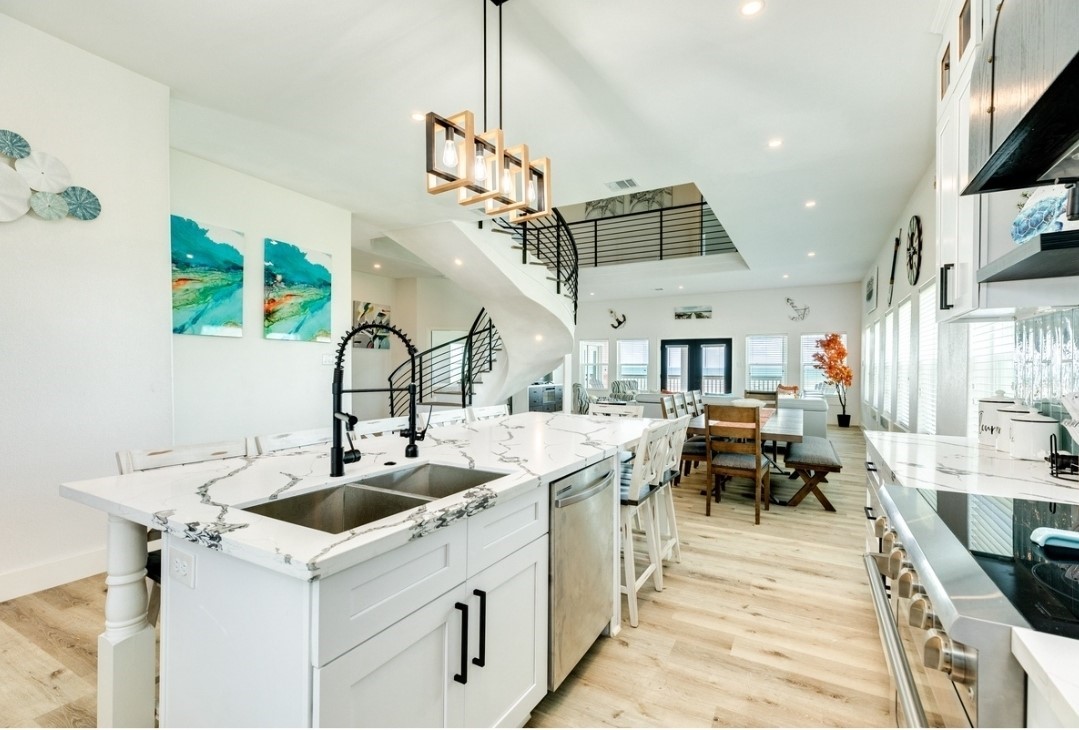 23245 Termini-San Luis Pass Road Galveston, TX 77554 - Photo 8 of 45 a kitchen with a sink a counter and chairs