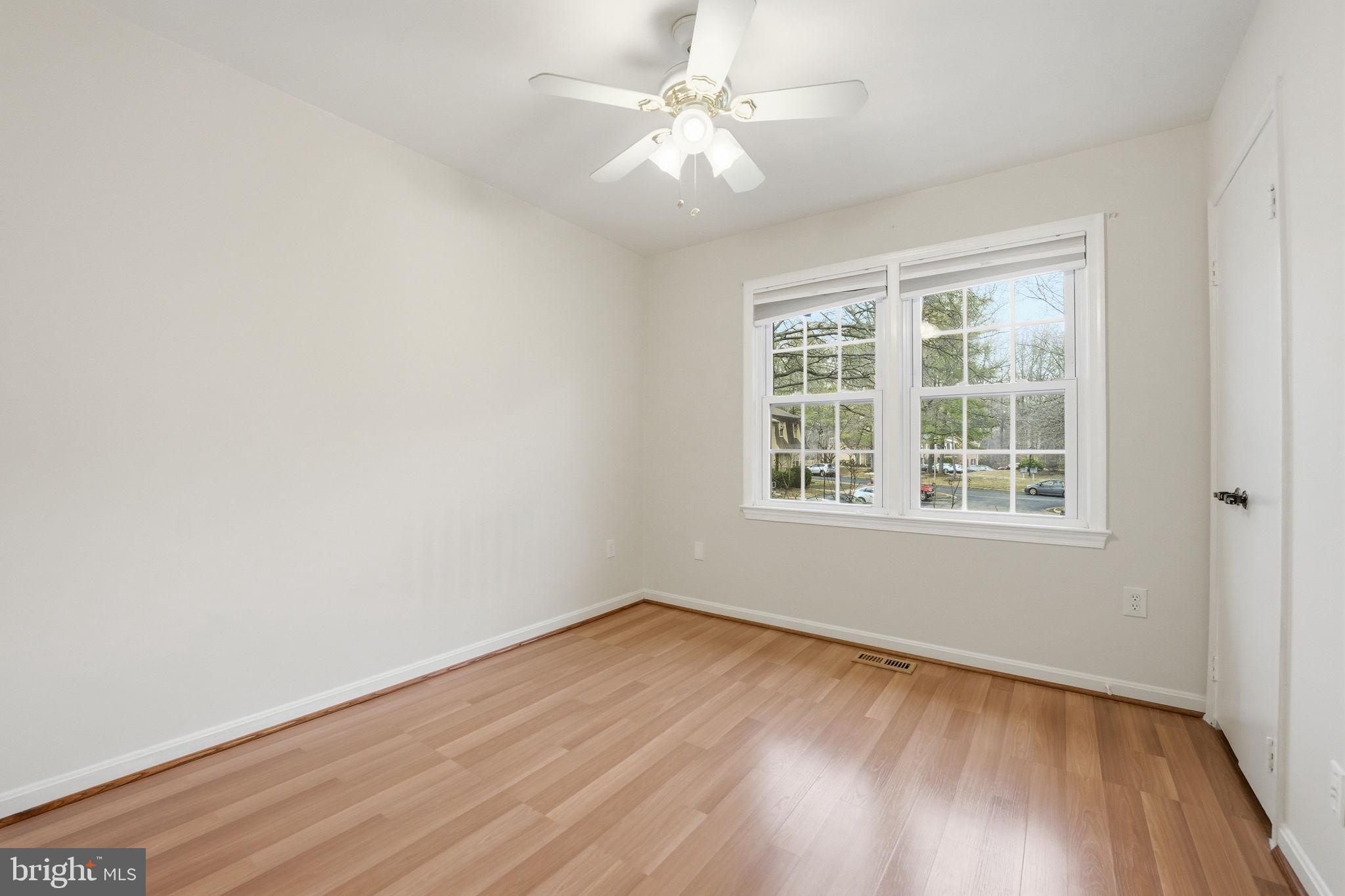 8967 Omega Court Springfield, VA 22152 - Photo 18 of 31 wooden floor in an empty room with a window