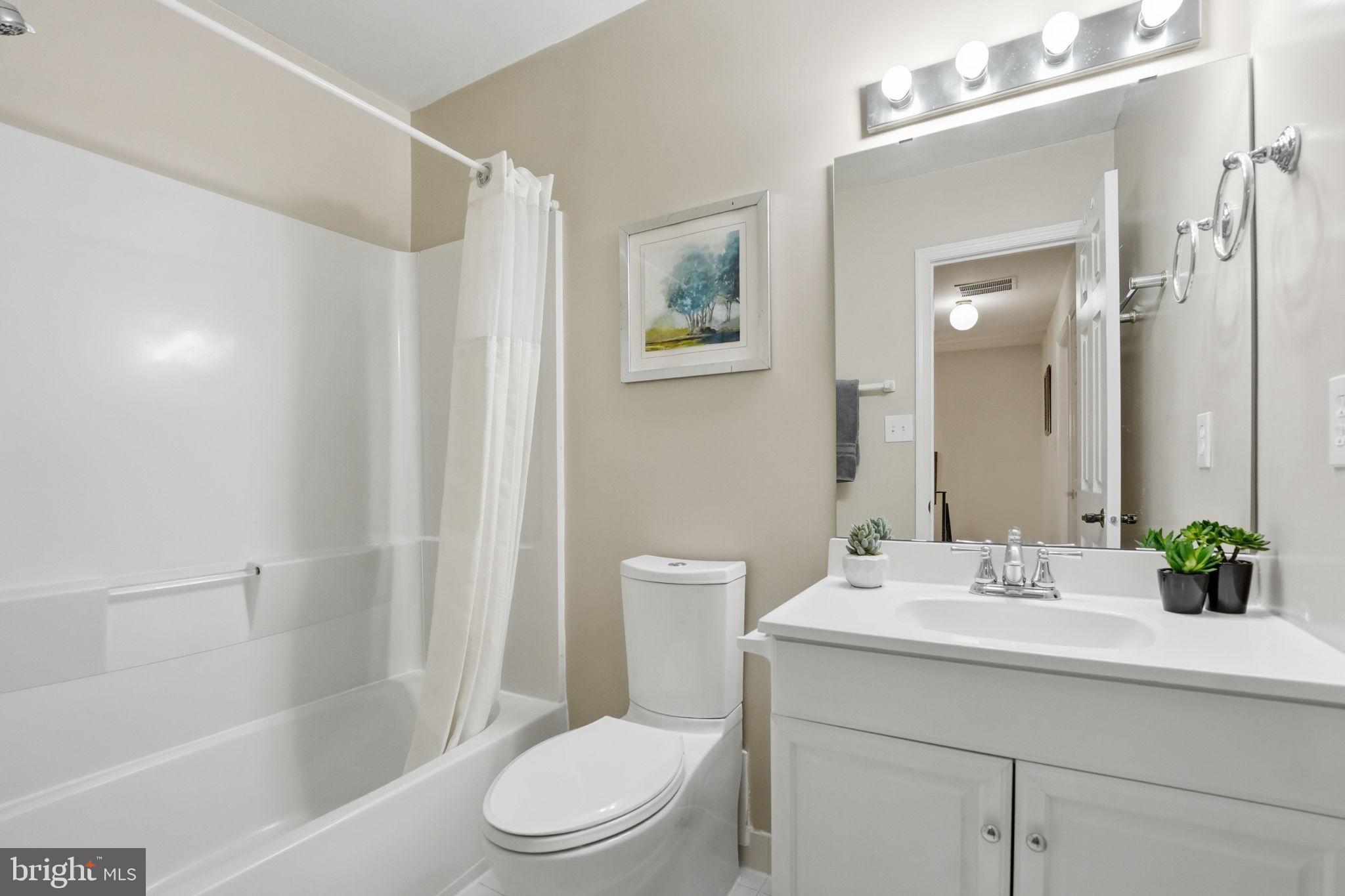 8967 Omega Court Springfield, VA 22152 - Photo 20 of 31 a bathroom with a sink a toilet and shower