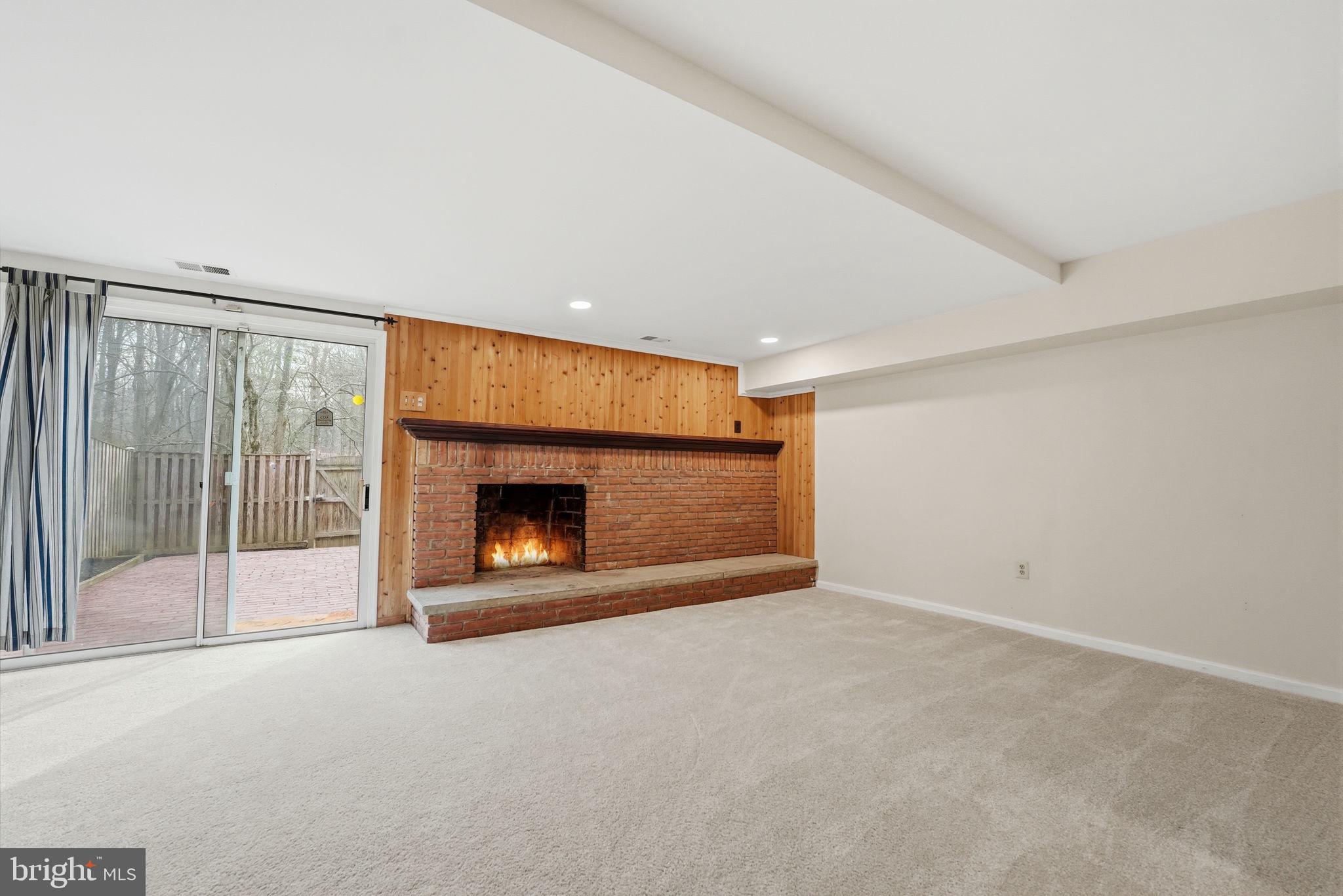 8967 Omega Court Springfield, VA 22152 - Photo 21 of 31 a view of an empty room with a fireplace
