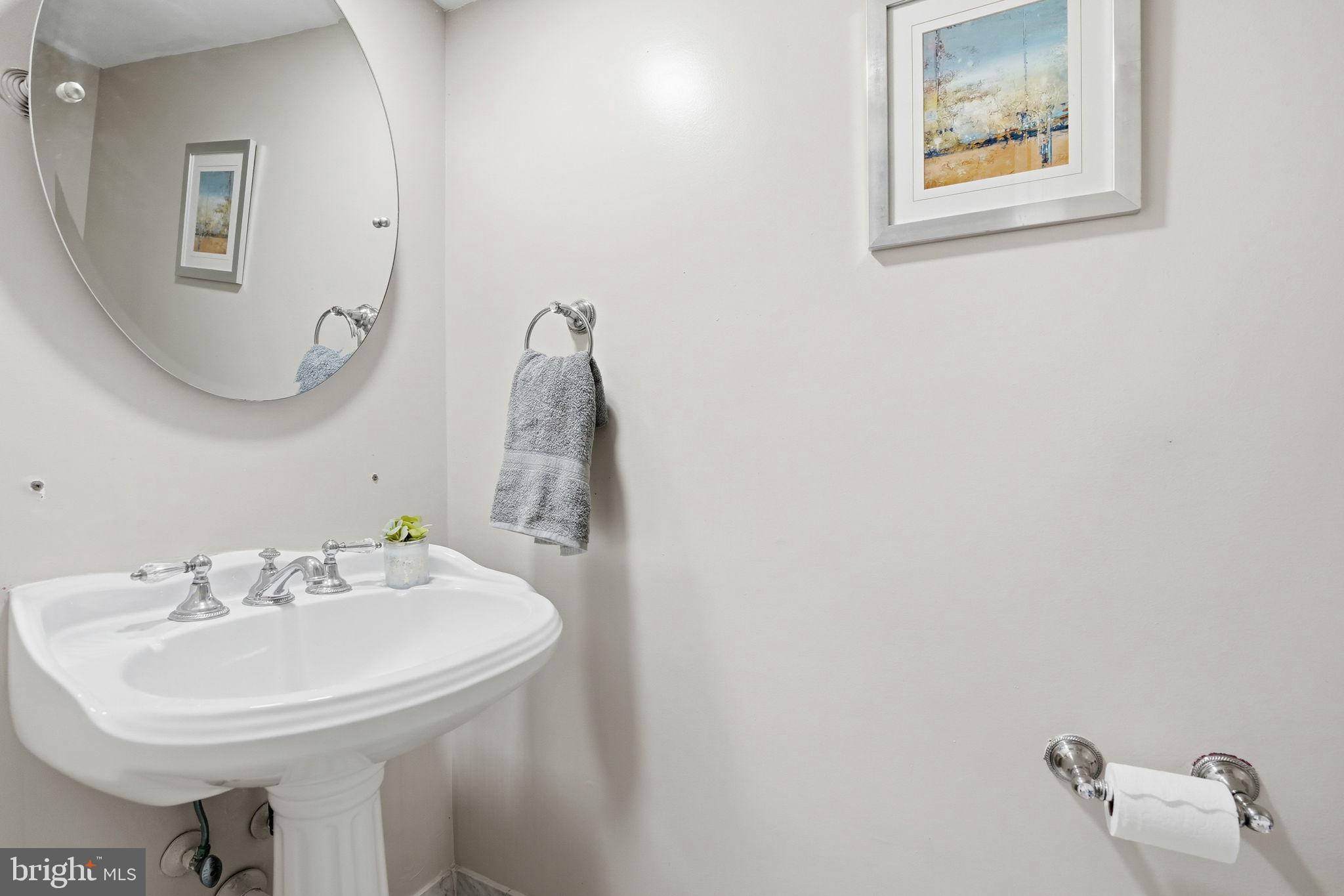 8967 Omega Court Springfield, VA 22152 - Photo 9 of 31 a bathroom with a sink and a mirror