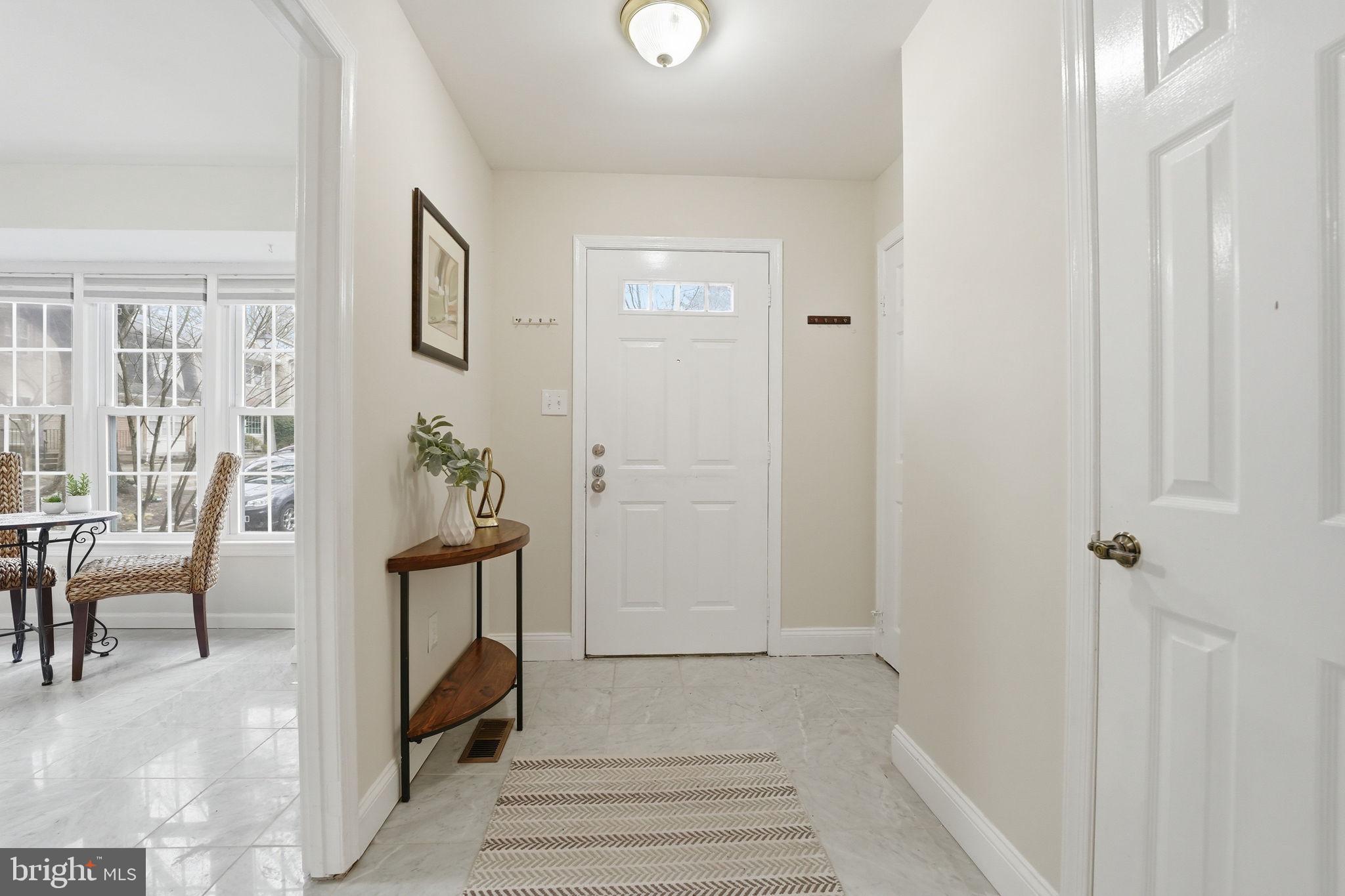8967 Omega Court Springfield, VA 22152 - Photo 10 of 31 a view of a hallway with living room and furniture