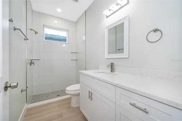 a view of a pathway of a house with wooden floor