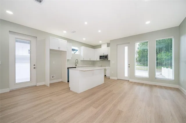 a view of kitchen with wooden floor