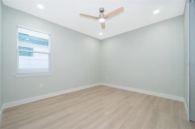 a bathroom with a granite countertop sink toilet a shower and a mirror
