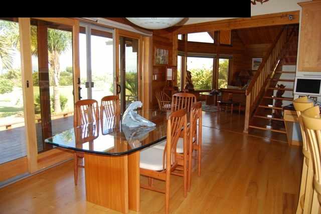 2120 Lilikoi Road Haiku, HI 96708 - Photo 4 of 29 a dining room with wooden floor and windows