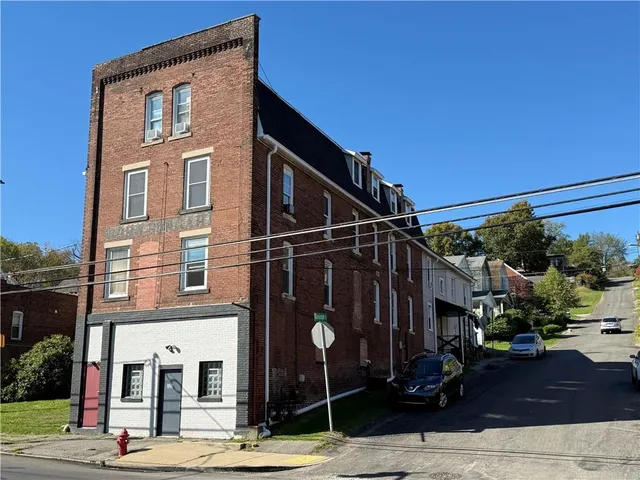 a front view of a building with street view