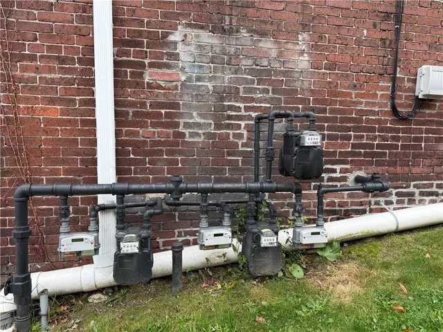 a view of storage and utility room with two windows
