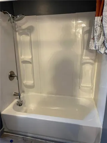 a white refrigerator freezer and a stove sitting inside of a kitchen