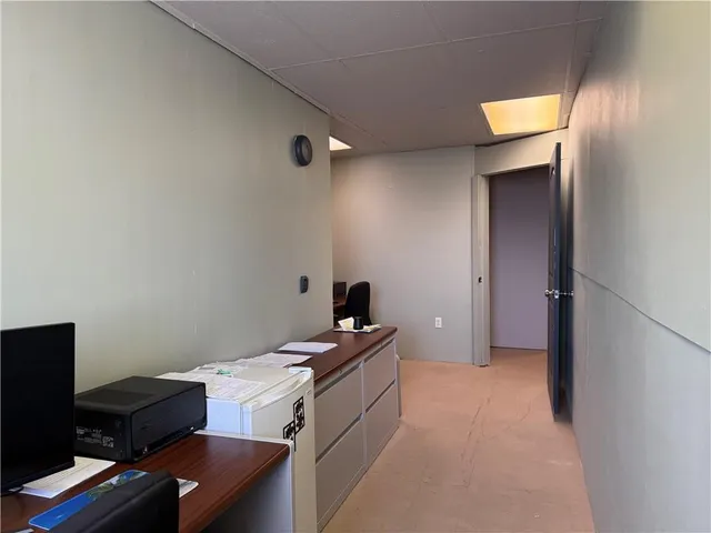 a room with furniture a washer and dryer