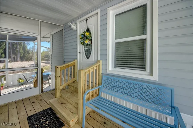 a living room with furniture a clock and a table