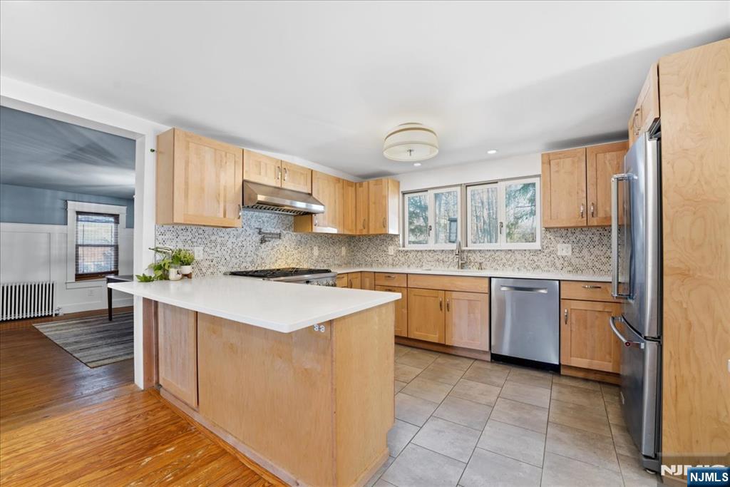 343-339 Quaker Church Road Randolph, NJ 07869 - Photo 24 of 38 a kitchen with stainless steel appliances granite countertop a stove a sink dishwasher and a refrigerator
