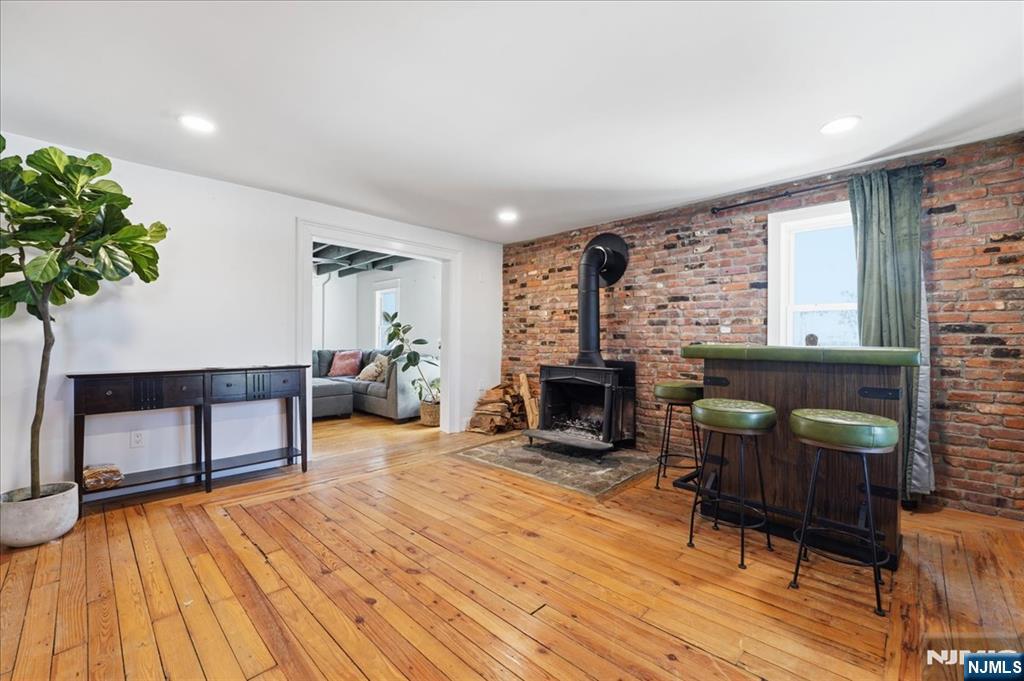 343-339 Quaker Church Road Randolph, NJ 07869 - Photo 36 of 38 a living room with furniture a fireplace and a potted plant