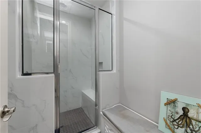 a bathroom with a sink and shower