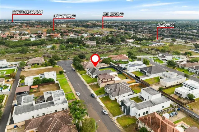 an aerial view of residential houses with outdoor space