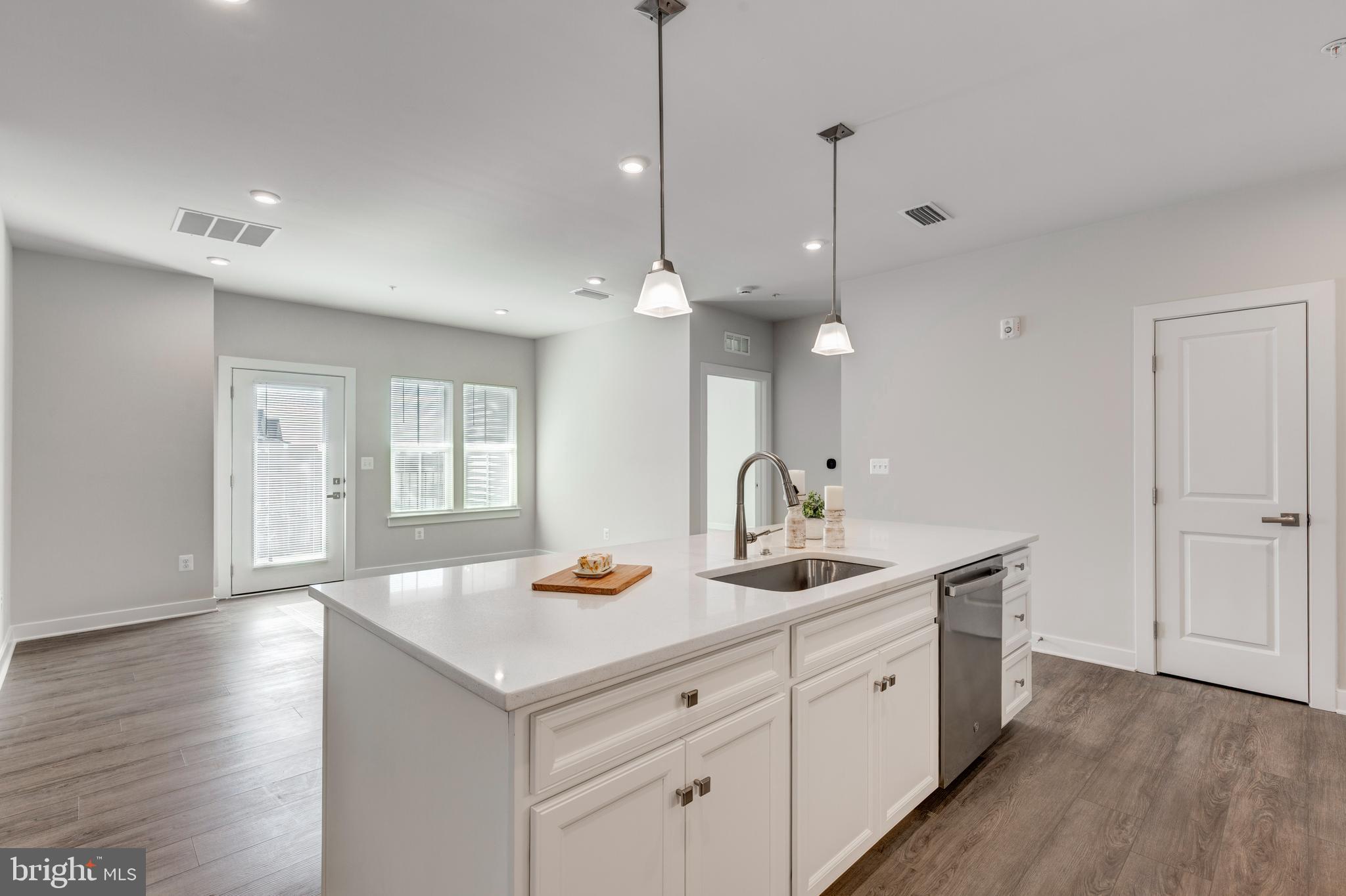 40 Liberty Road, Unit T Sykesville, MD 21784 - Photo 12 of 31 a kitchen with a sink cabinets and wooden floor