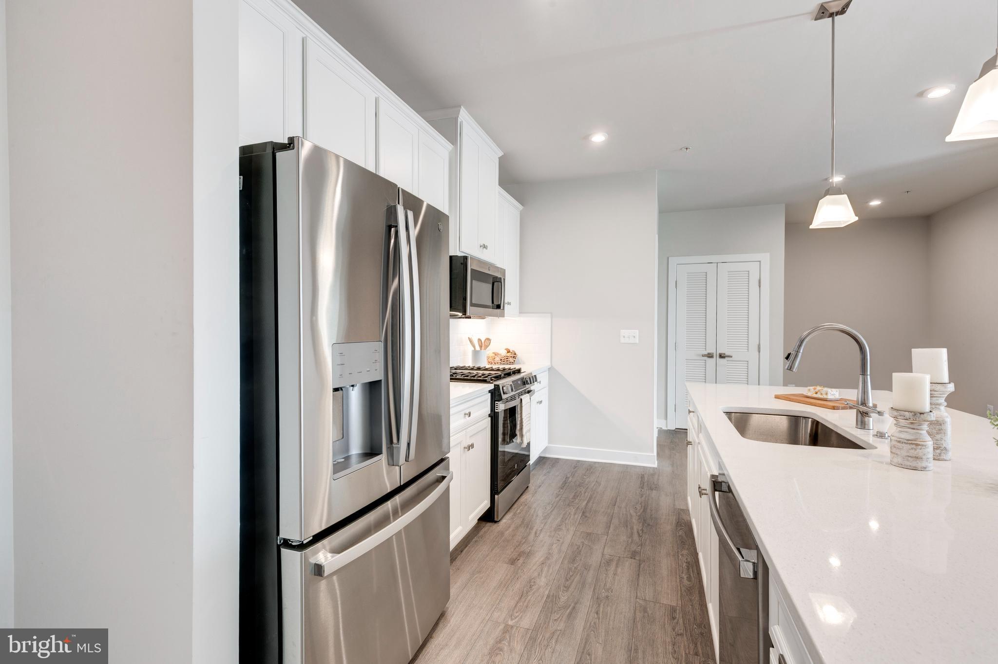 40 Liberty Road, Unit T Sykesville, MD 21784 - Photo 13 of 31 a kitchen with stainless steel appliances granite countertop a refrigerator and a sink