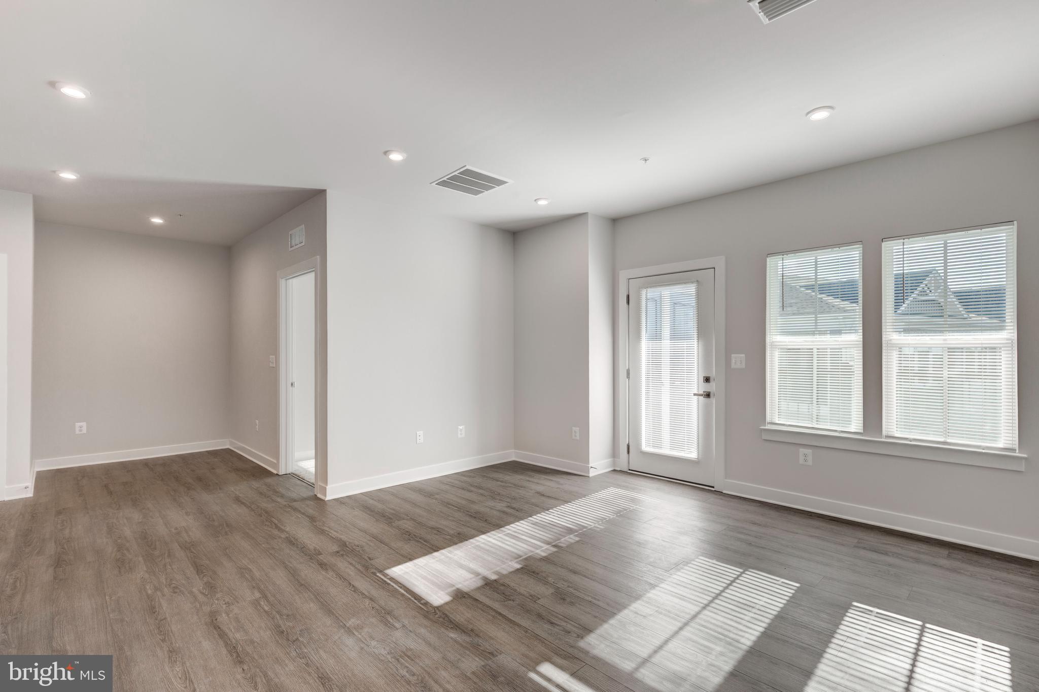 40 Liberty Road, Unit T Sykesville, MD 21784 - Photo 14 of 31 an empty room with wooden floor and windows