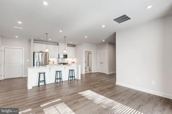 a kitchen with a table and chairs in it