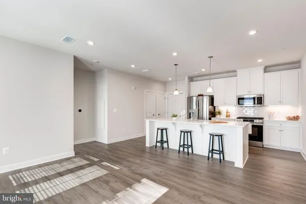 a view of a room with wooden floor and closet