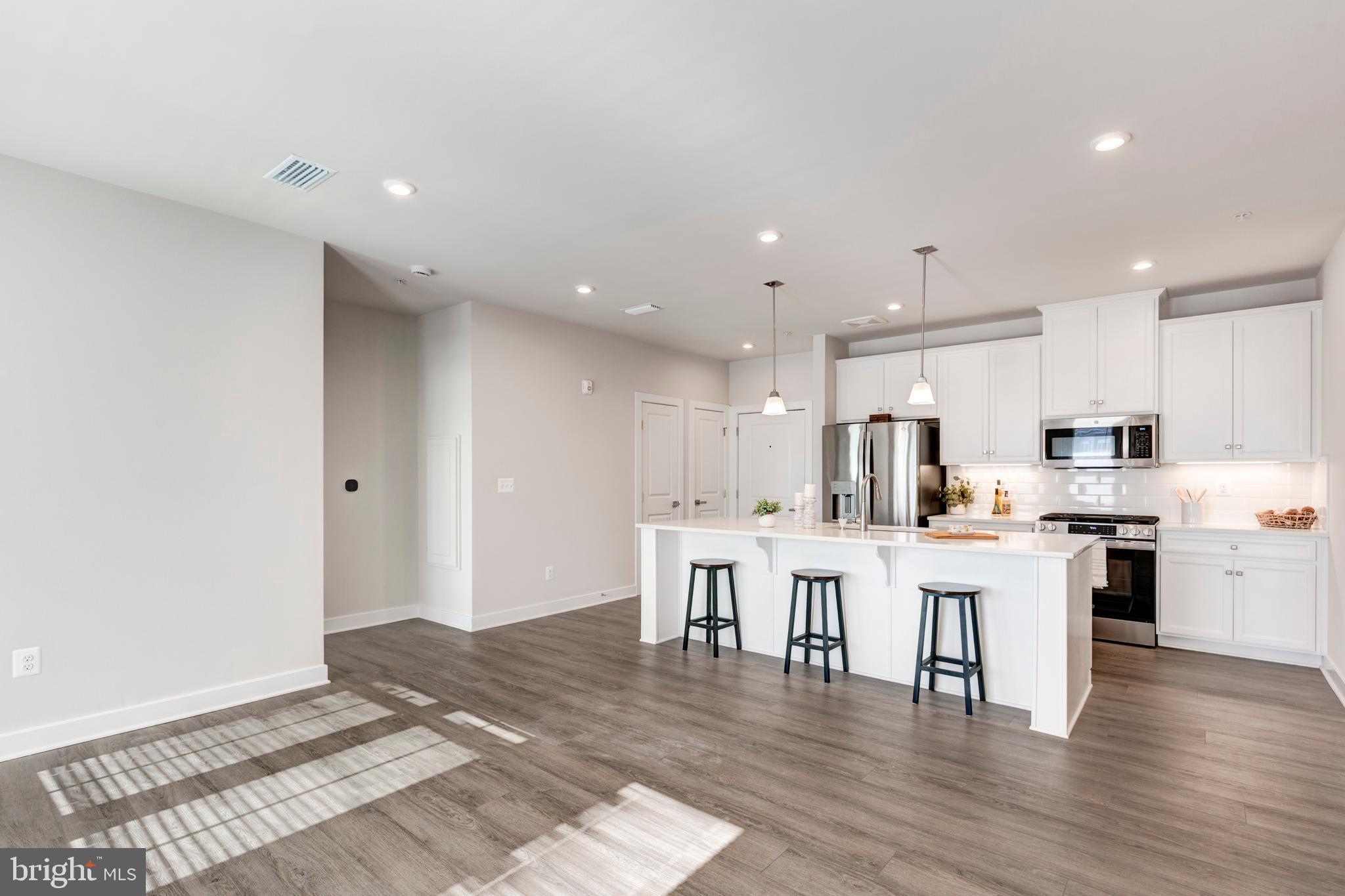 40 Liberty Road, Unit T Sykesville, MD 21784 - Photo 16 of 31 a kitchen with a table and chairs in it