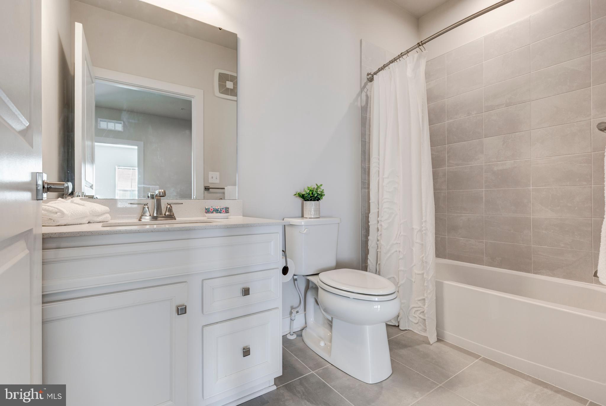 40 Liberty Road, Unit T Sykesville, MD 21784 - Photo 21 of 31 a bathroom with a sink toilet and shower