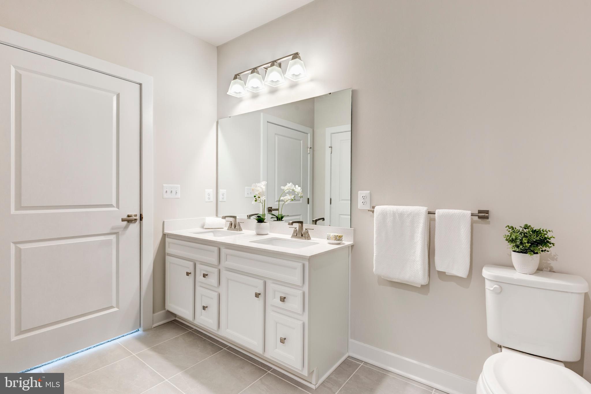 40 Liberty Road, Unit T Sykesville, MD 21784 - Photo 25 of 31 a bathroom with a sink and a mirror