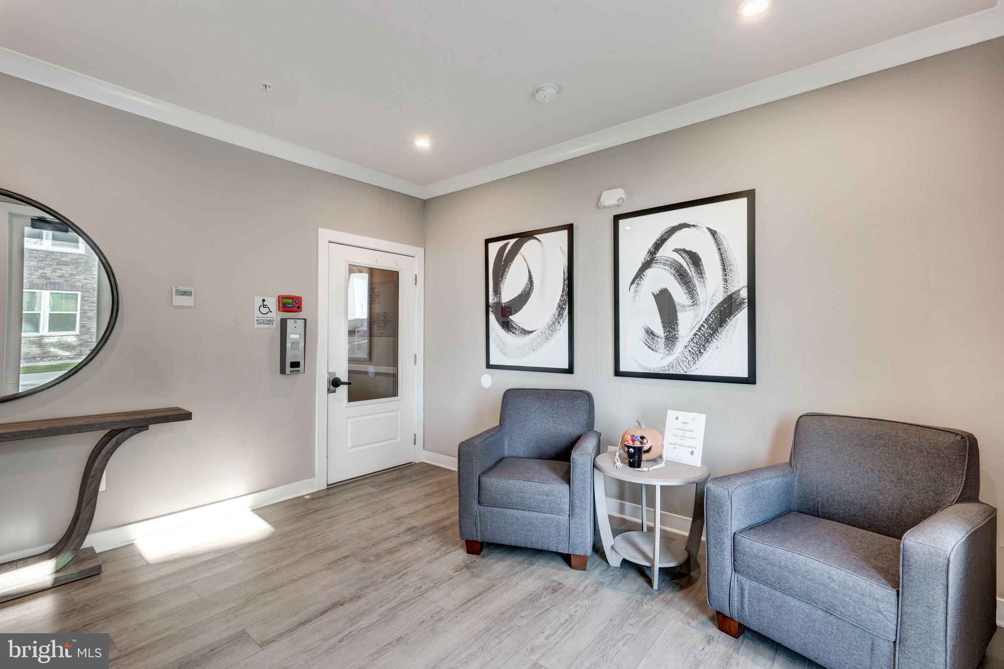40 Liberty Road, Unit T Sykesville, MD 21784 - Photo 6 of 31 a living room with furniture mirror and a wooden floor