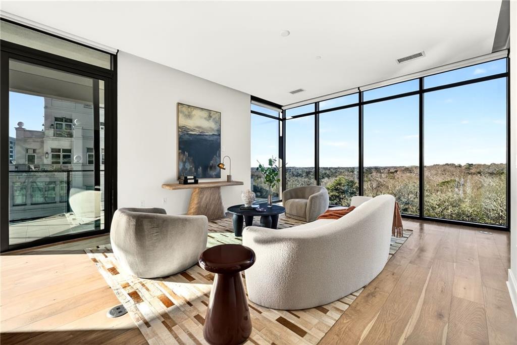 2520 Peachtree Road Northwest, Unit 1003 Atlanta, GA 30305 - Photo 11 of 63 a living room with furniture and a floor to ceiling window