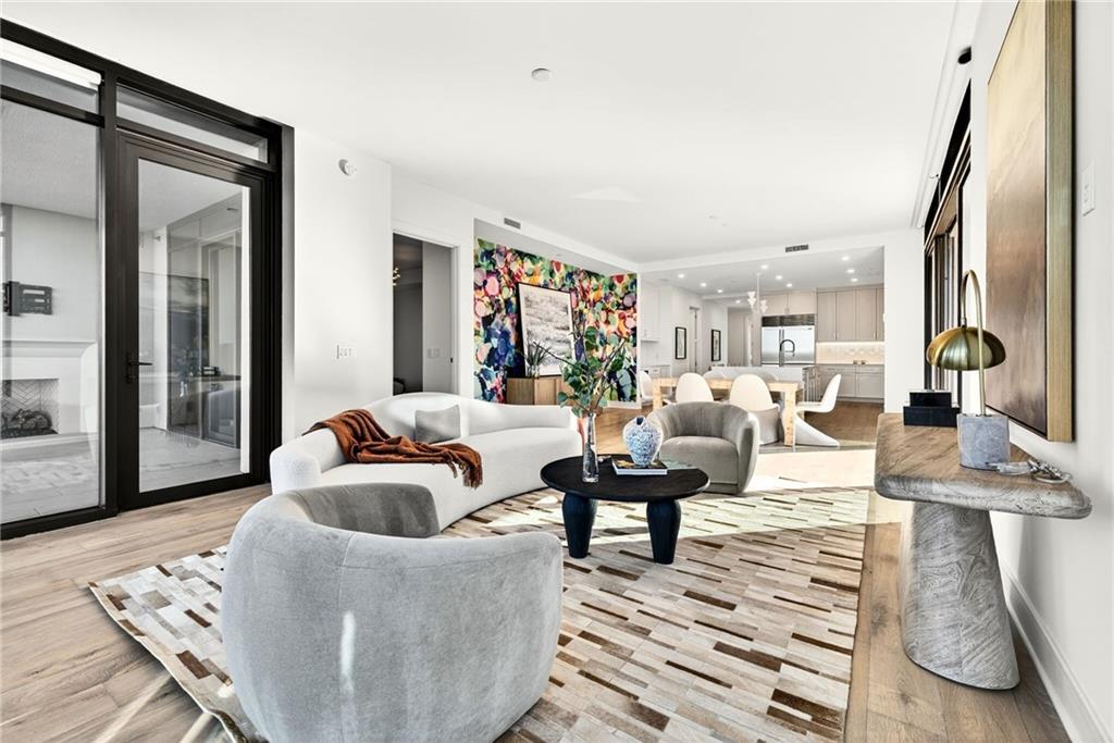 2520 Peachtree Road Northwest, Unit 1003 Atlanta, GA 30305 - Photo 13 of 63 a living room with furniture and a rug