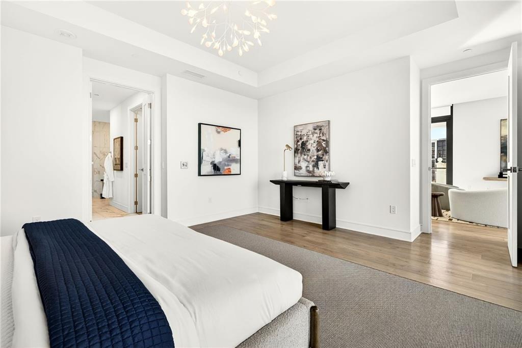 2520 Peachtree Road Northwest, Unit 1003 Atlanta, GA 30305 - Photo 20 of 63 a bedroom with a bed and a view of bathroom