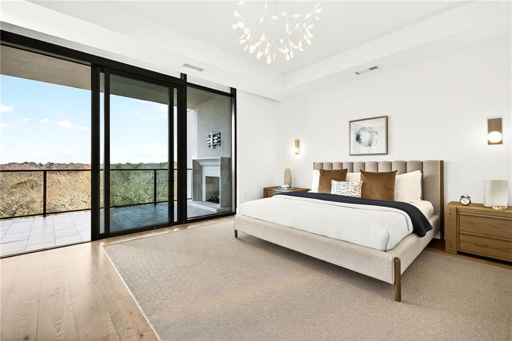 2520 Peachtree Road Northwest, Unit 1003 Atlanta, GA 30305 - Photo 21 of 63 a spacious bedroom with a large bed and a large window