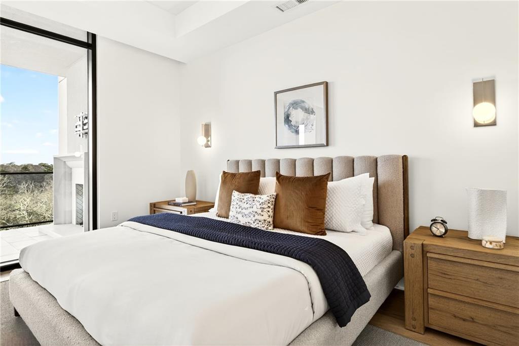 2520 Peachtree Road Northwest, Unit 1003 Atlanta, GA 30305 - Photo 22 of 63 a bed room with a bed and a night stand