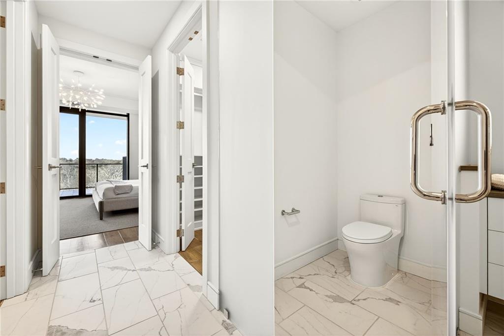 2520 Peachtree Road Northwest, Unit 1003 Atlanta, GA 30305 - Photo 26 of 63 a bathroom with a toilet and a shower
