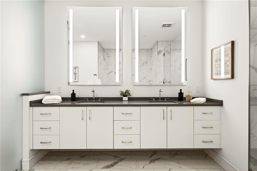 2520 Peachtree Road Northwest, Unit 1003 Atlanta, GA 30305 - Photo 29 of 63 a bathroom with white cabinets sink and vanity