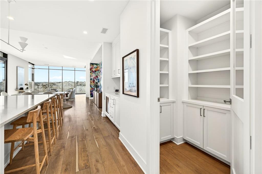 2520 Peachtree Road Northwest, Unit 1003 Atlanta, GA 30305 - Photo 3 of 63 a view of a kitchen with wooden floor and stairs