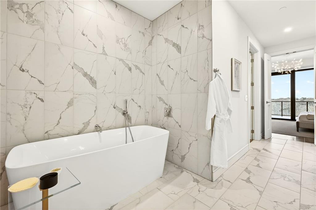 2520 Peachtree Road Northwest, Unit 1003 Atlanta, GA 30305 - Photo 31 of 63 a view of a bathtub in a bathroom