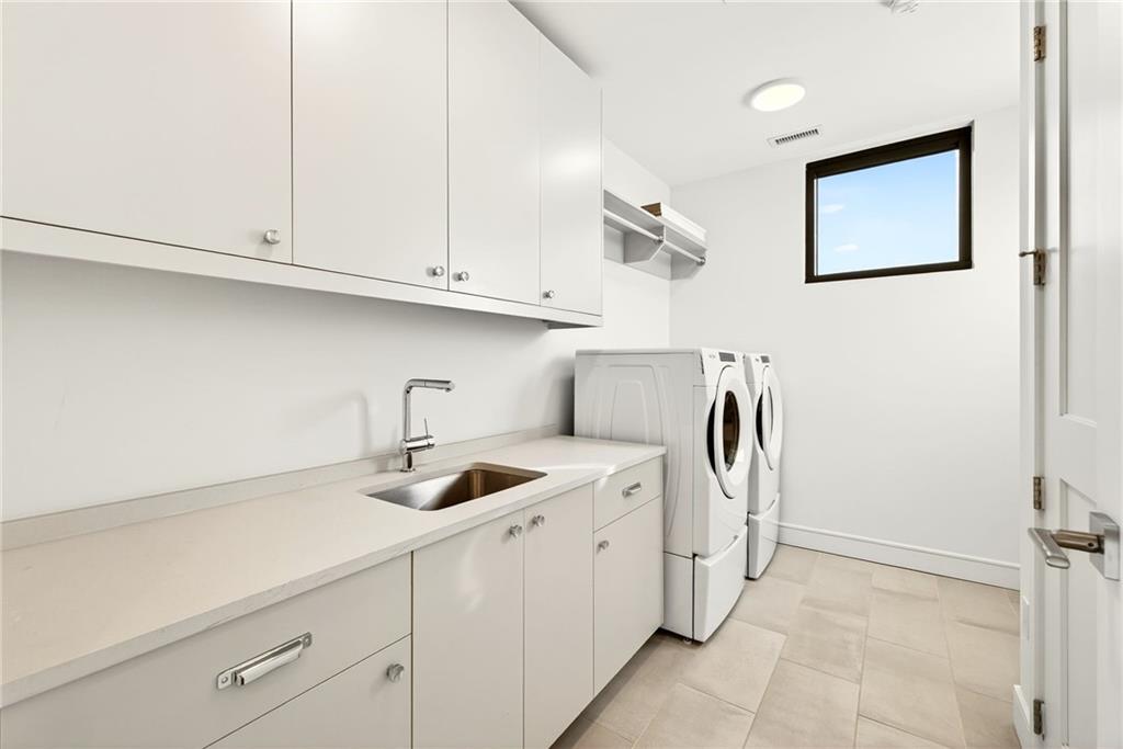 2520 Peachtree Road Northwest, Unit 1003 Atlanta, GA 30305 - Photo 35 of 63 a kitchen with stainless steel appliances granite countertop a sink a stove and white cabinets