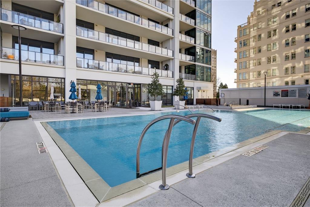2520 Peachtree Road Northwest, Unit 1003 Atlanta, GA 30305 - Photo 46 of 63 a view of a swimming pool with outdoor seating