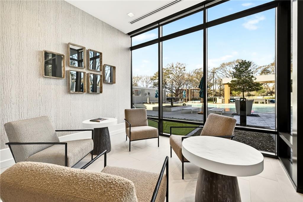 2520 Peachtree Road Northwest, Unit 1003 Atlanta, GA 30305 - Photo 49 of 63 a living room with furniture and a floor to ceiling window