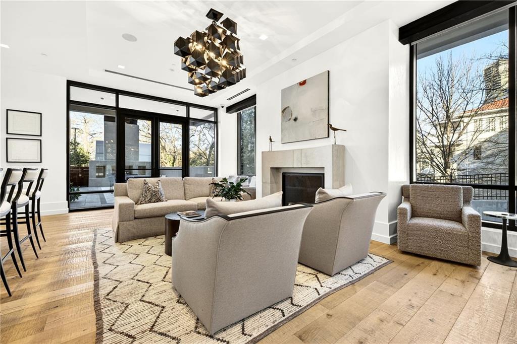 2520 Peachtree Road Northwest, Unit 1003 Atlanta, GA 30305 - Photo 53 of 63 a living room with furniture a fireplace and a large window