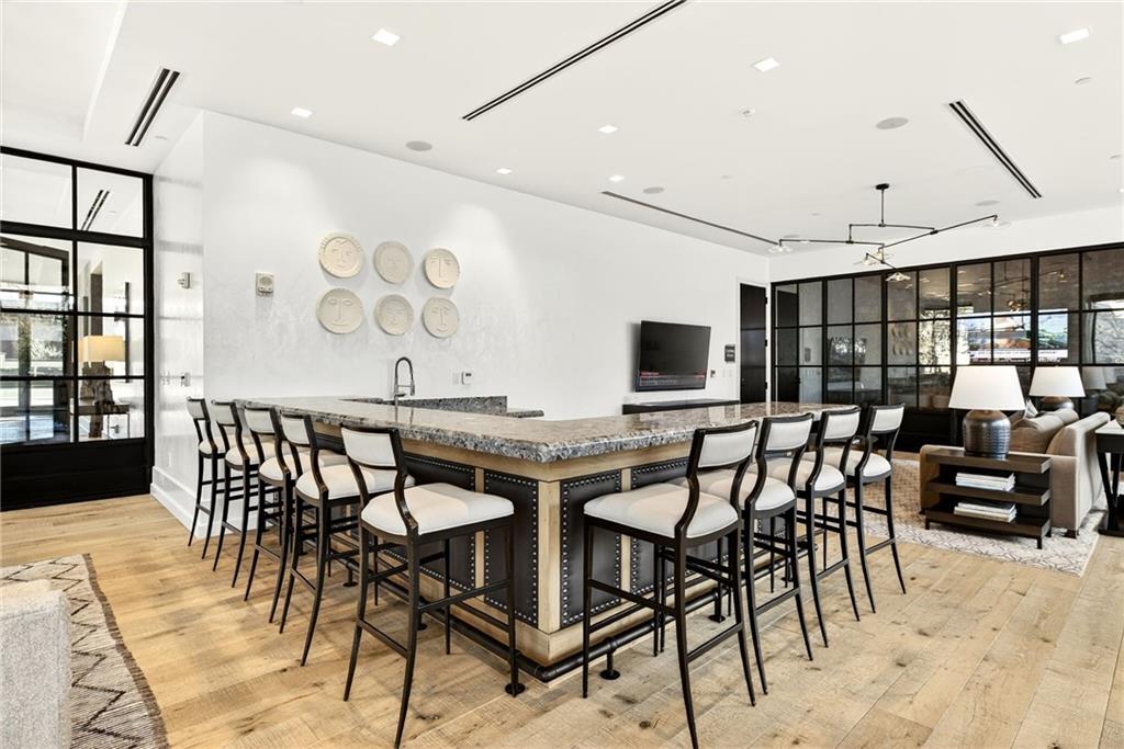 2520 Peachtree Road Northwest, Unit 1003 Atlanta, GA 30305 - Photo 54 of 63 a view of a a dining room with furniture window and wooden floor