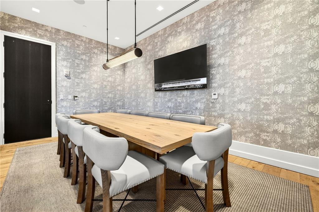 2520 Peachtree Road Northwest, Unit 1003 Atlanta, GA 30305 - Photo 55 of 63 a living room with a flat screen tv and chairs