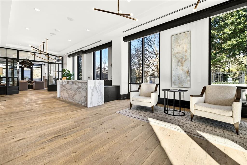 2520 Peachtree Road Northwest, Unit 1003 Atlanta, GA 30305 - Photo 56 of 63 a spacious bedroom with a large bed and a large window