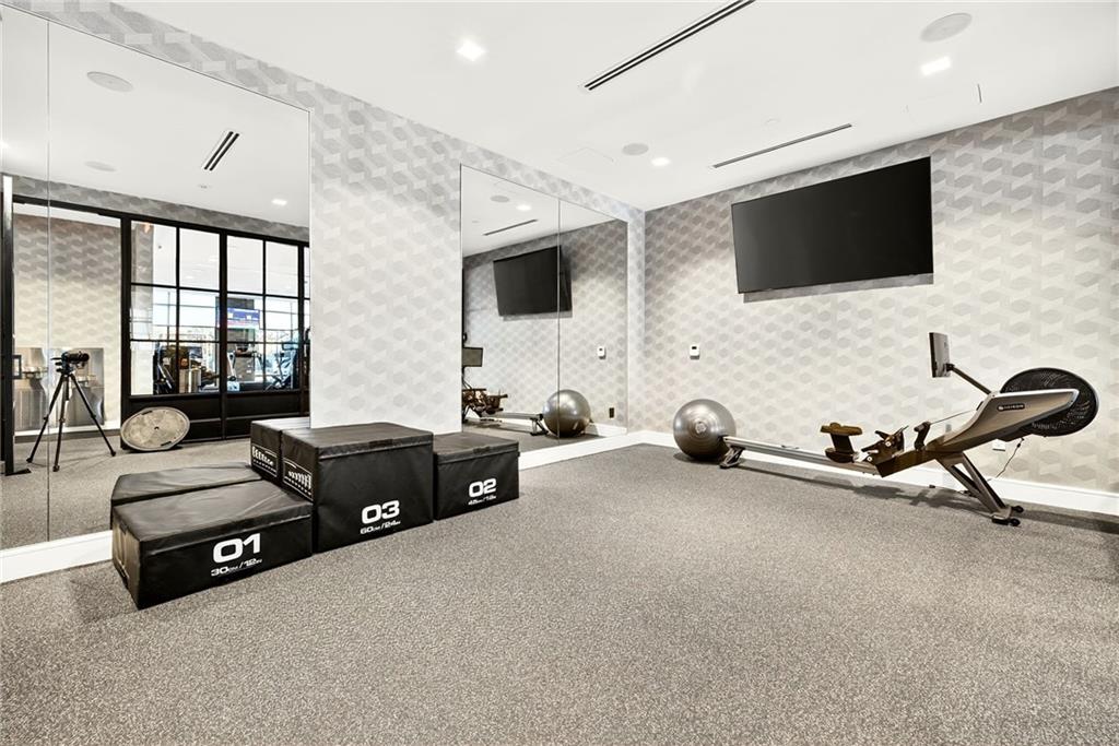 2520 Peachtree Road Northwest, Unit 1003 Atlanta, GA 30305 - Photo 58 of 63 a living room with furniture and a flat screen tv