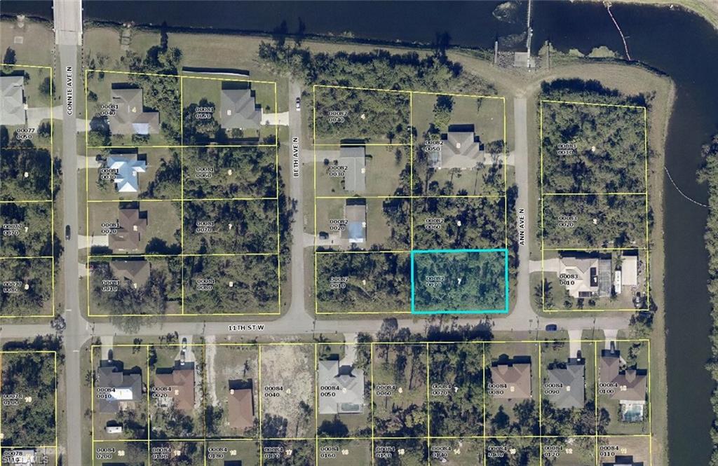 Tbd Tbd Corner Lehigh Acres, FL 33971 - Photo 5 of 6 a view of a glass building with a glass door