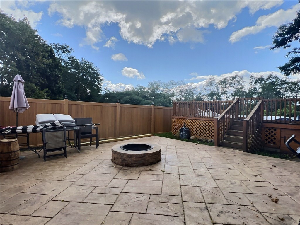5278 Old Telephone Road Bethany, NY 14054 - Photo 30 of 36 Stamped concrete patio with firepit