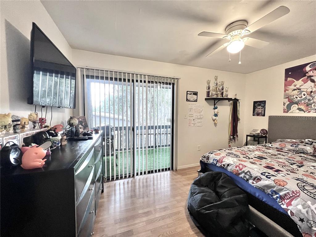 2811 Southwest Archer Road, Unit Z244 Gainesville, FL 32608 - Photo 8 of 18 a bed room with a bed and a couch