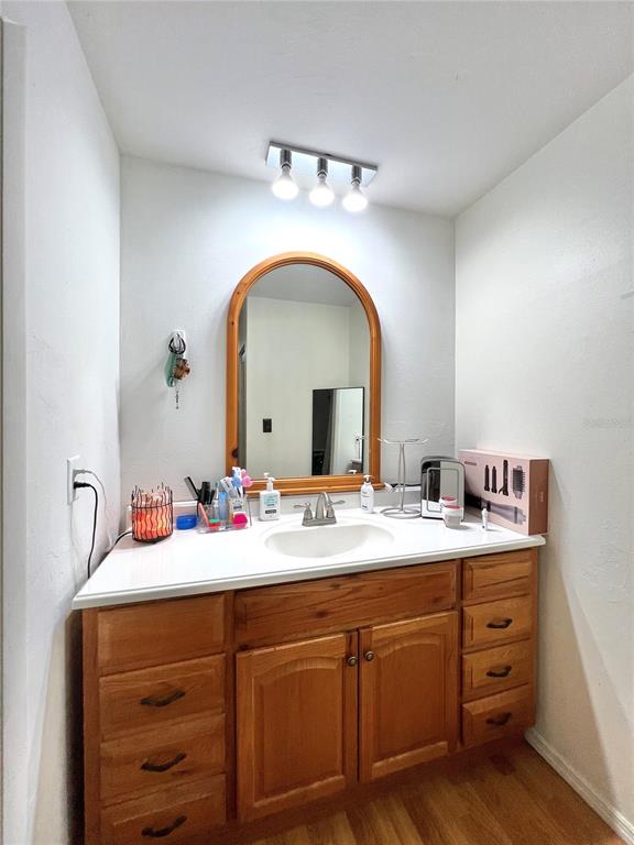 2811 Southwest Archer Road, Unit Z244 Gainesville, FL 32608 - Photo 10 of 18 a bathroom with a sink and a mirror