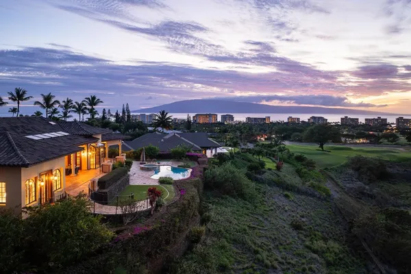 an aerial view of a house with a garden